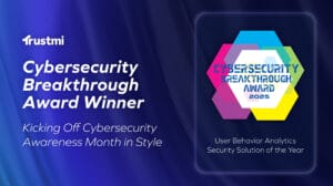 A digital graphic announces Trustmi as the CyberSecurity Breakthrough Awards Winner 2025 for User Behavior Analytics Security Solution of the Year, showcasing cybersecurity innovation with vibrant geometric shapes and text on a blue gradient background.